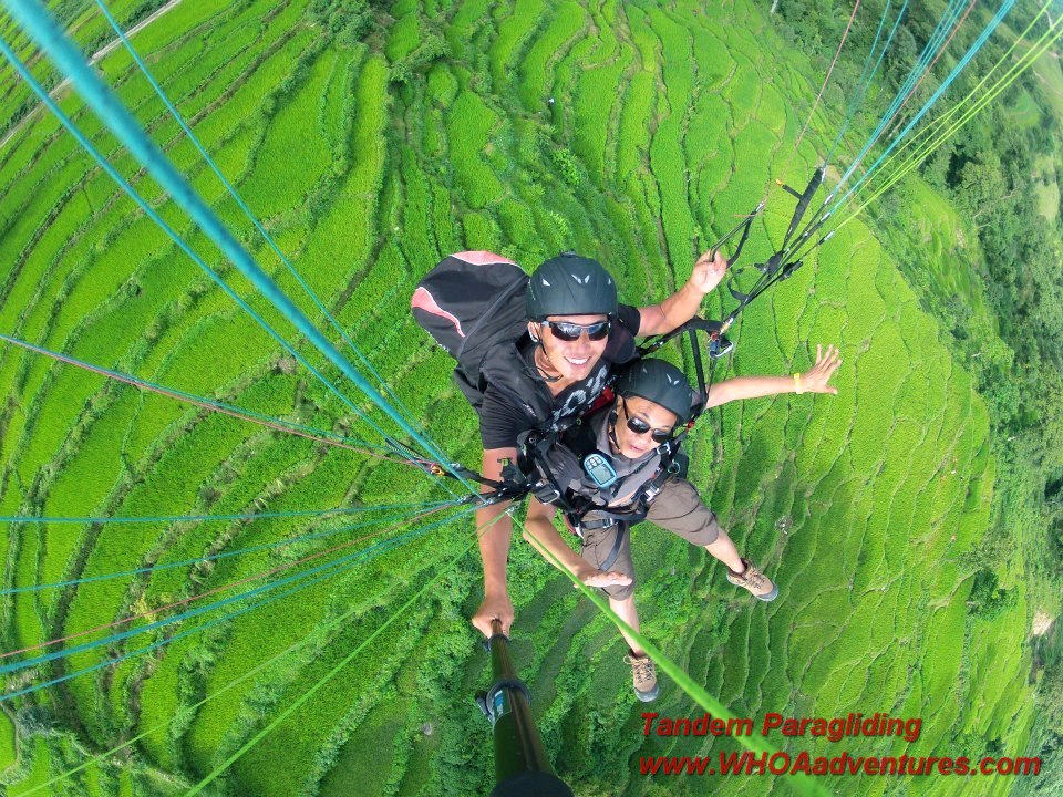 One of the Tandem Paragliding Pilots with  a guest passenger in Nepal